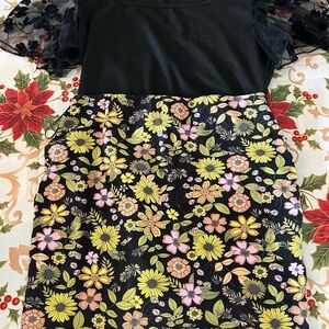 Black bodysuit size large. Floral skirt size 6. Tie dye bodysuit size medium.